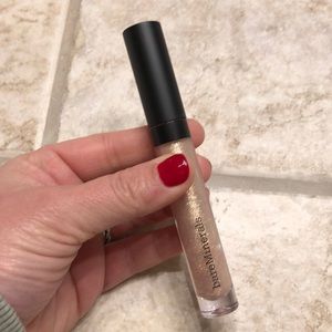 BareMineras moxie plumping lip gloss in 24 Karat